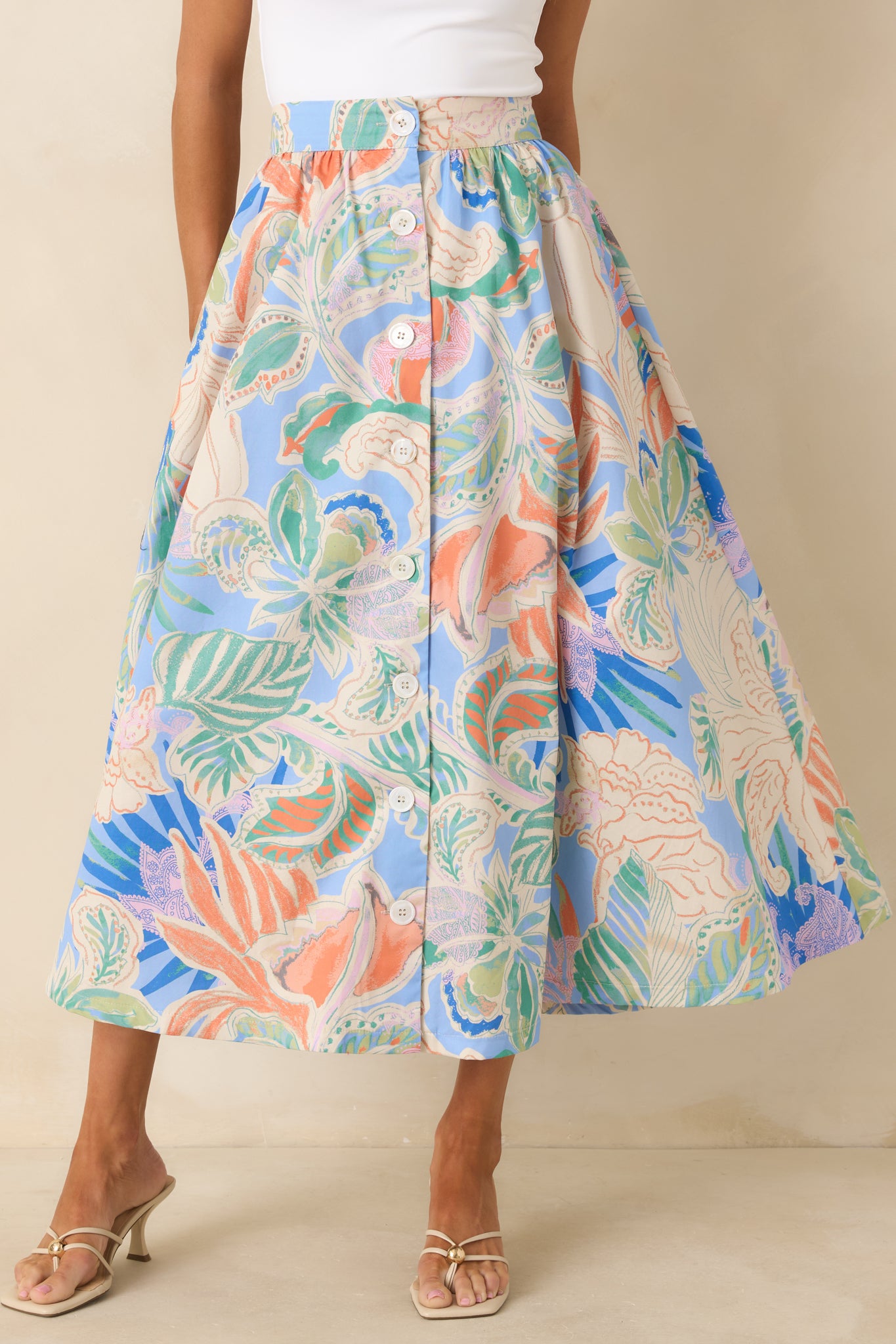 Midsection view of skirt showcasing front buttons and gentle A-line drape.