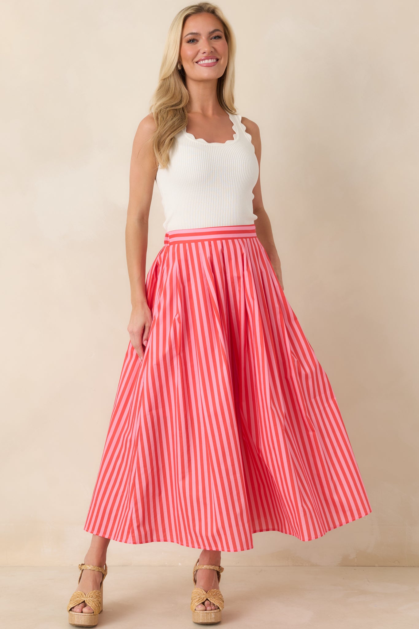 Cotton maxi skirt with a full silhouette and elongated drape, finished with a clean waistband for a polished look.