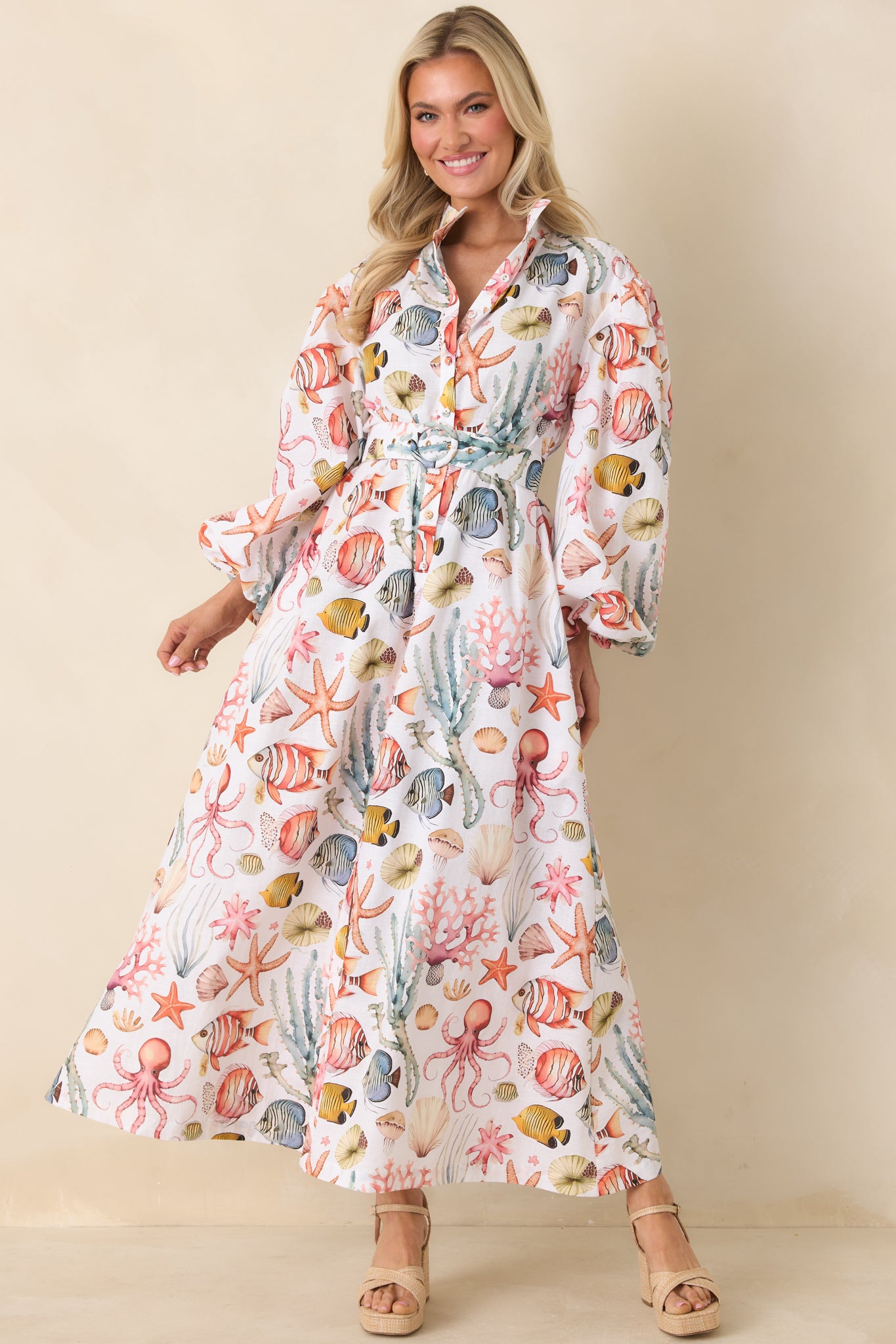 Breathable cotton-linen maxi dress designed with a defined waist, classic collar, and long sleeves for an airy yet polished look.