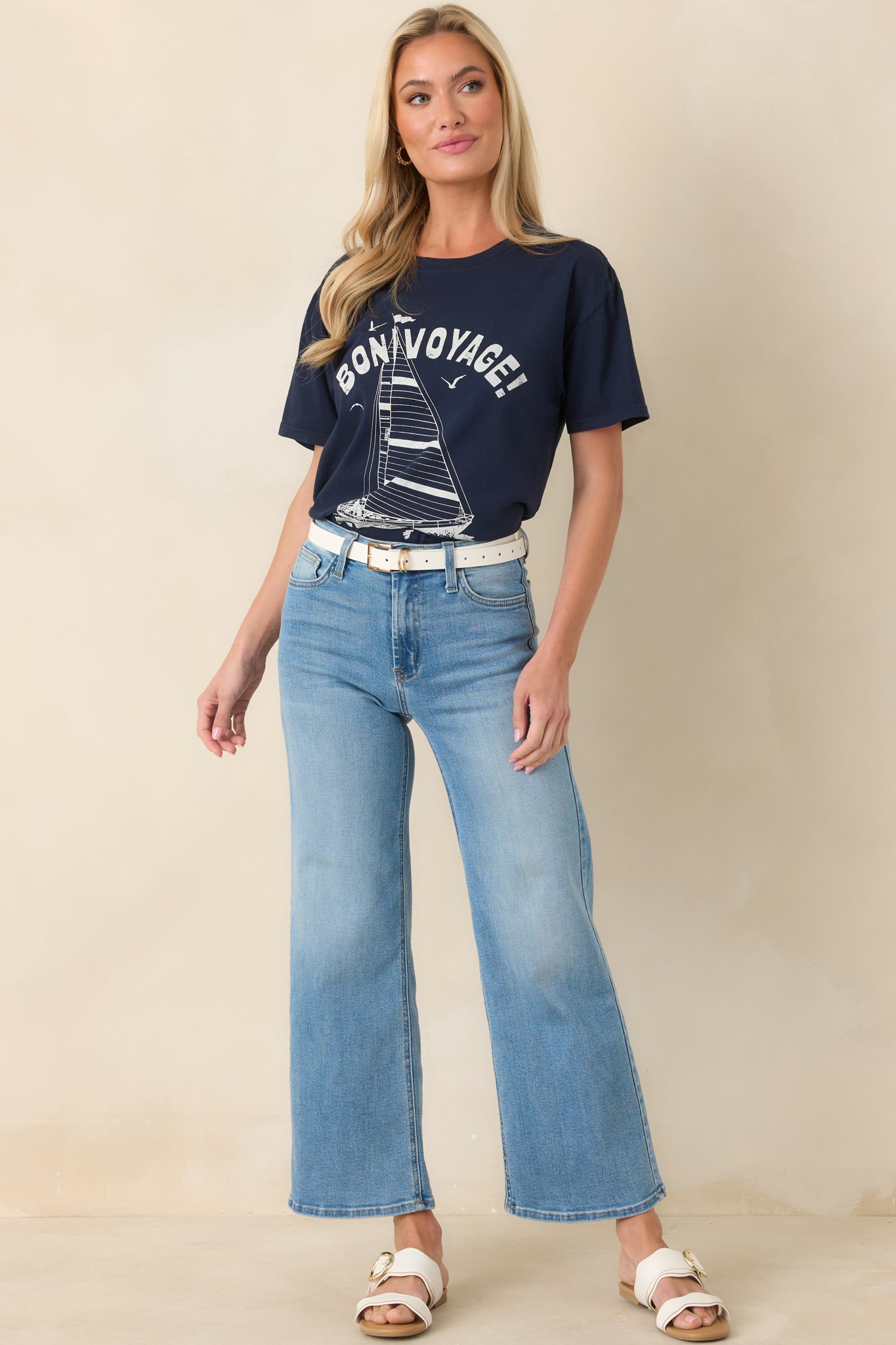 Navy tee with a relaxed boyfriend fit, classic crew neckline, short sleeves, and a straight hem for effortless everyday wear.