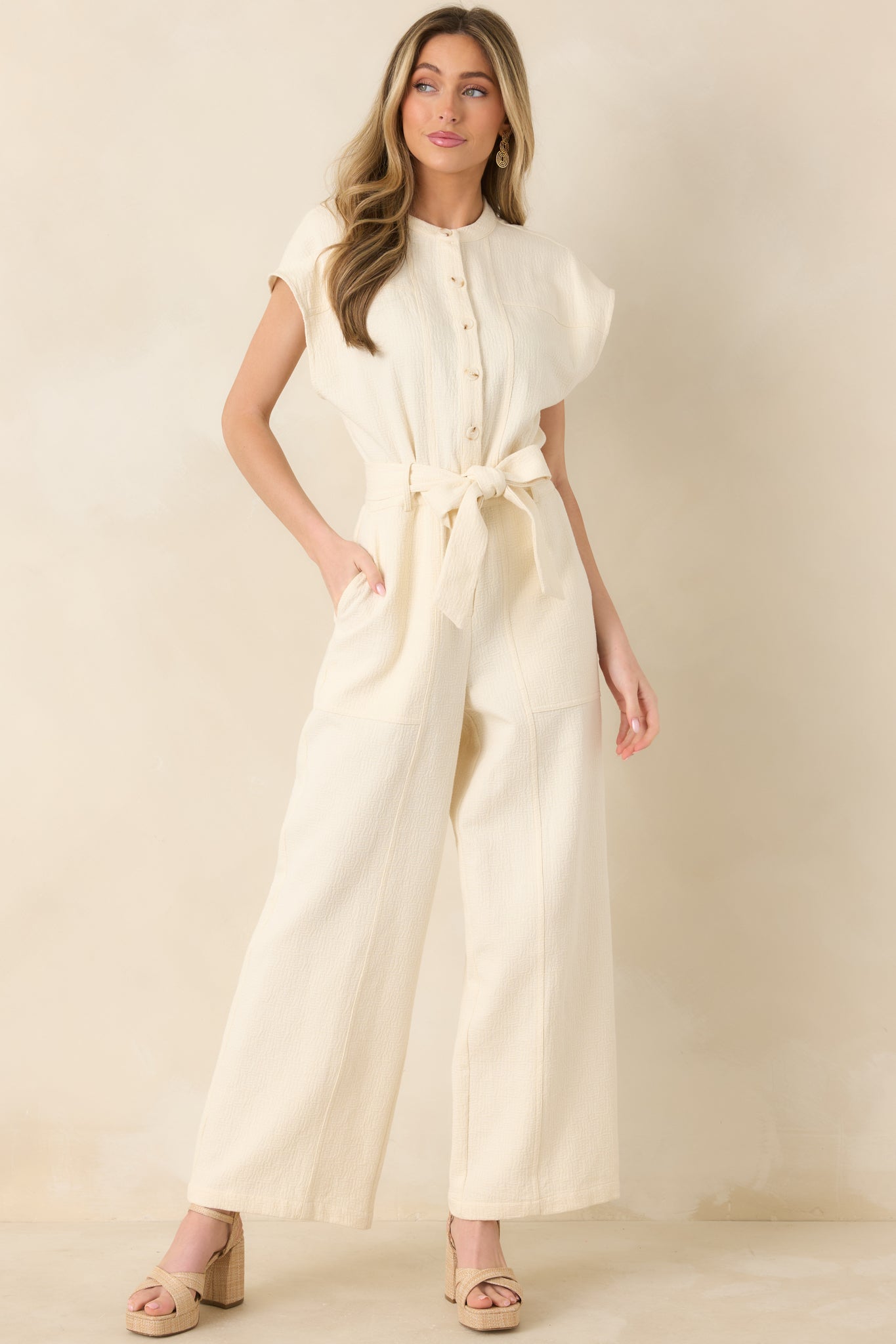 Full-length front shot highlighting removable self-tie belt cinching the waist and relaxed structured fit.