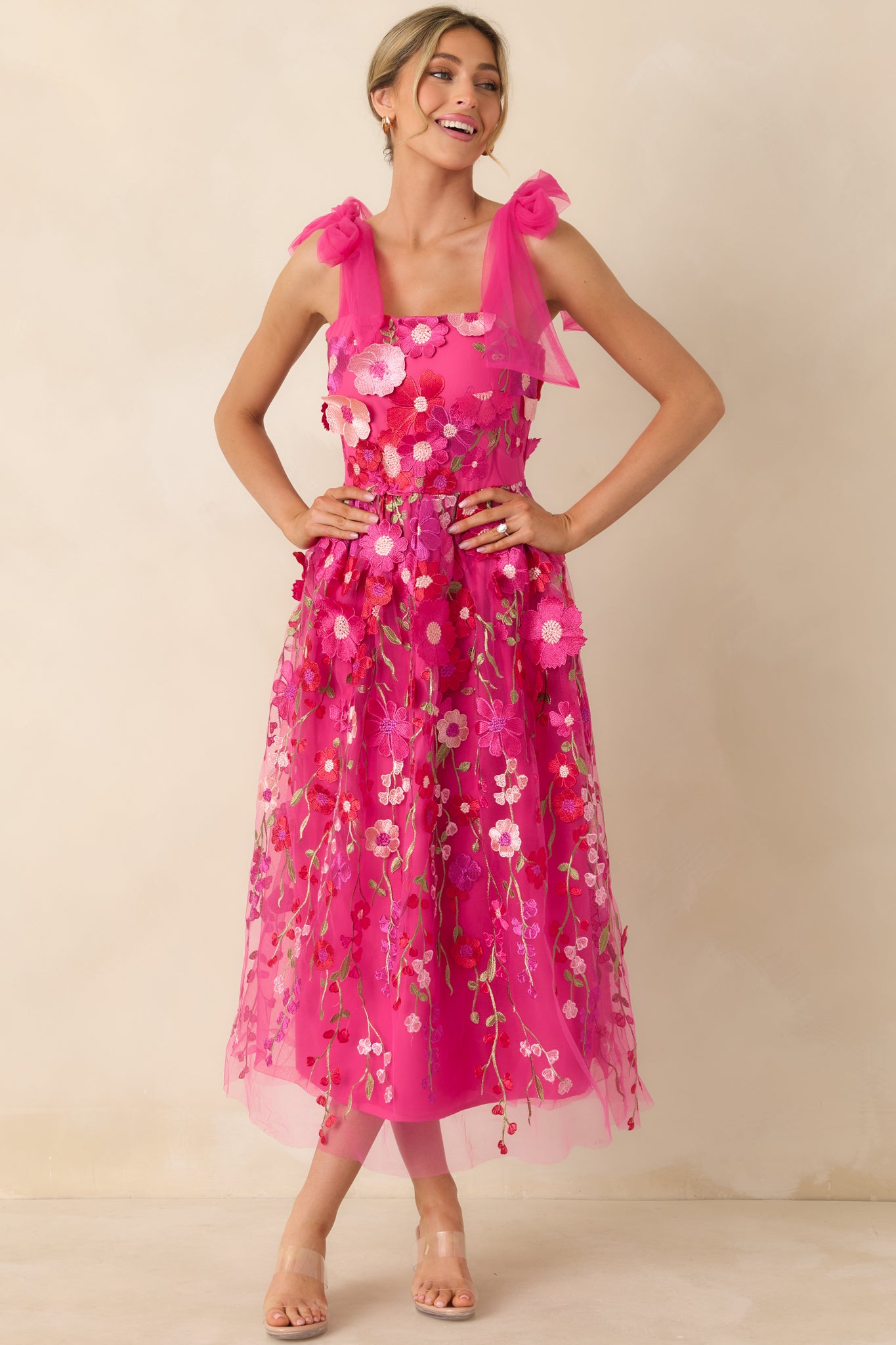 Full-length view of the pink dress showcasing the sheer organza self-tie straps and embellished bodice.