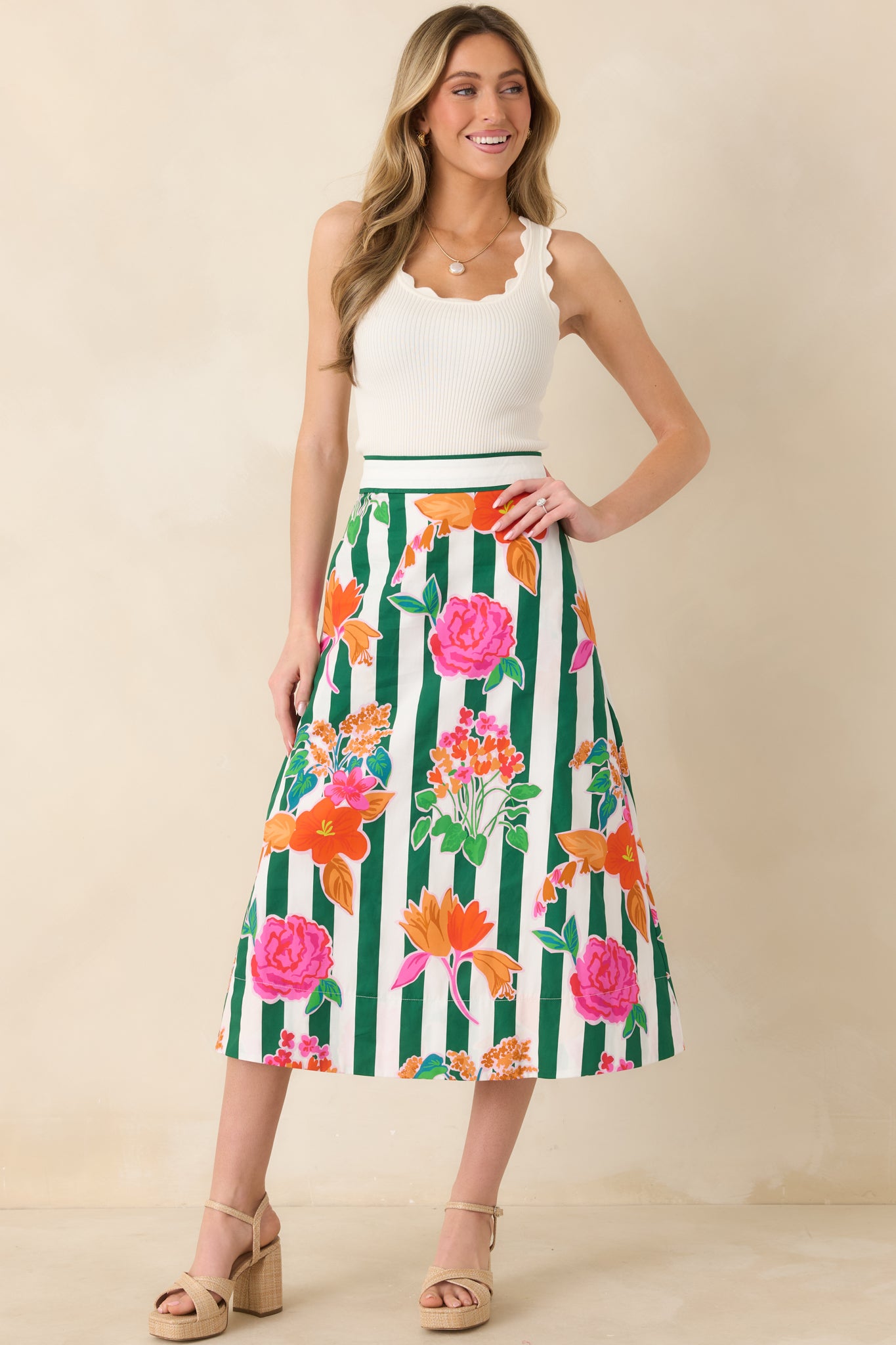 Full front view of tank highlighting smooth fabric and relaxed fit with scalloped hem detail.