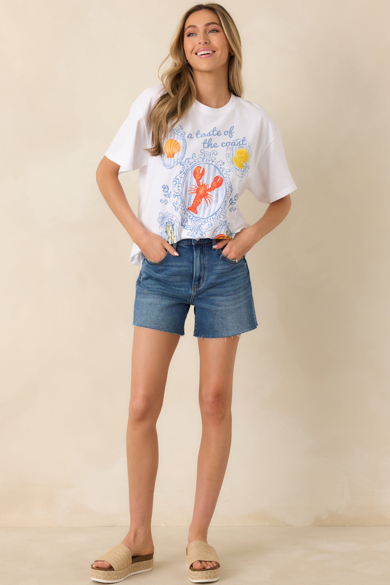 Casual white tee with short sleeves and a colorful coastal graphic print for a playful, relaxed look.