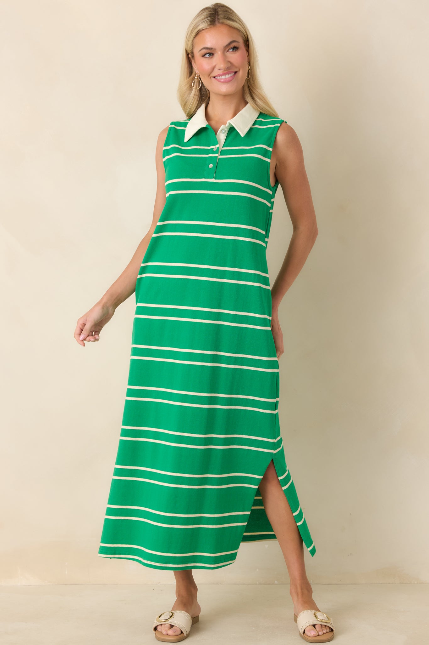 Straight-cut green striped maxi dress with a sleeveless fit, contrast collar, and subtle button-front closure for a polished yet relaxed look.