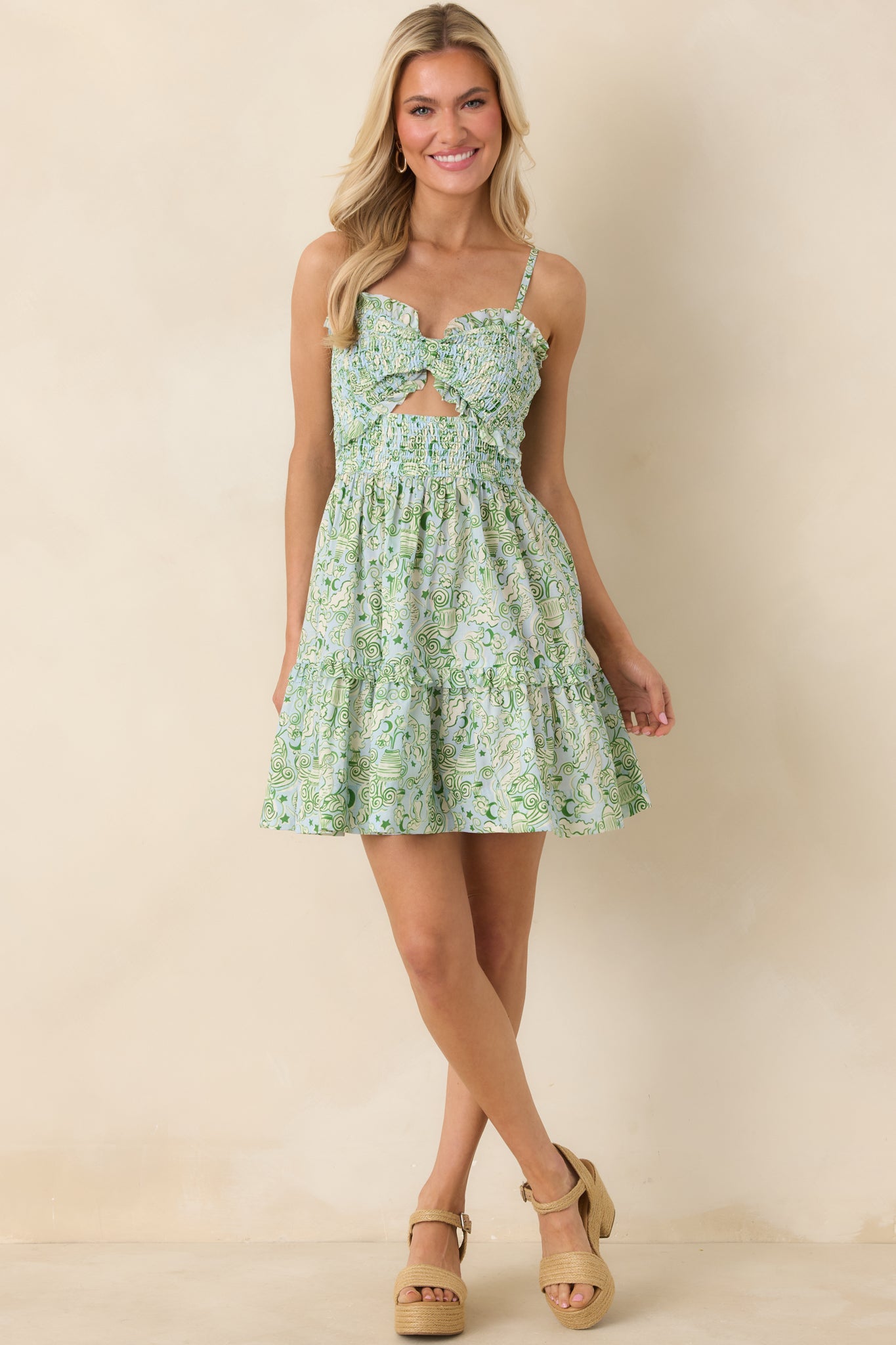 Blue and green cotton mini dress with adjustable spaghetti straps, smocked bodice, and tiered ruffle hem.