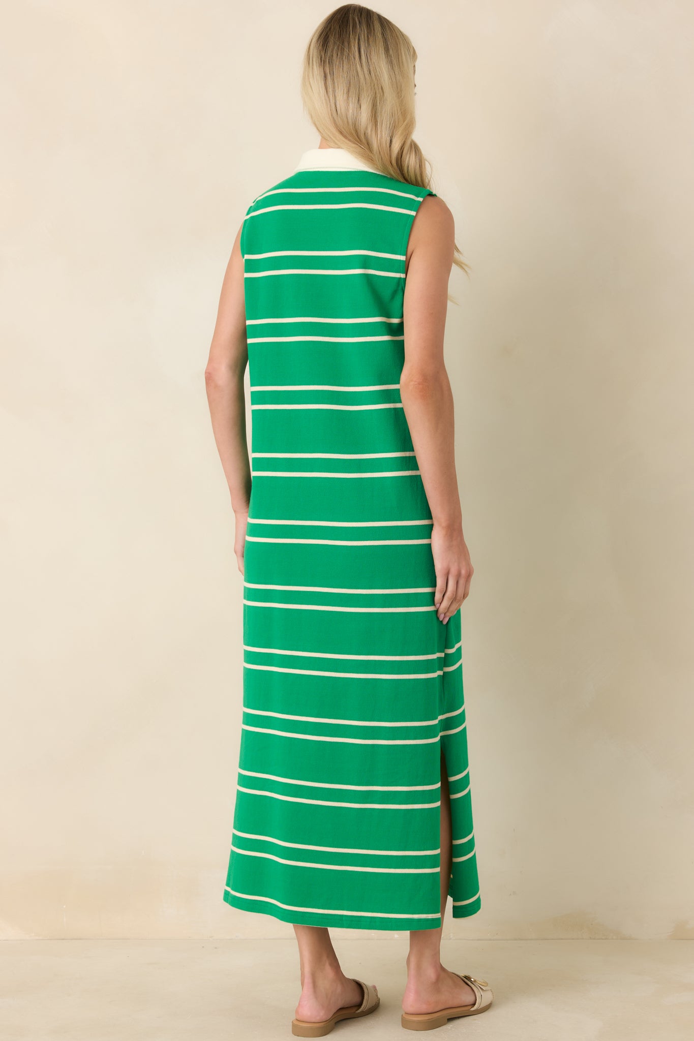 Rear view of the green striped maxi dress showing the straight, relaxed silhouette and sleeveless design for airy comfort.