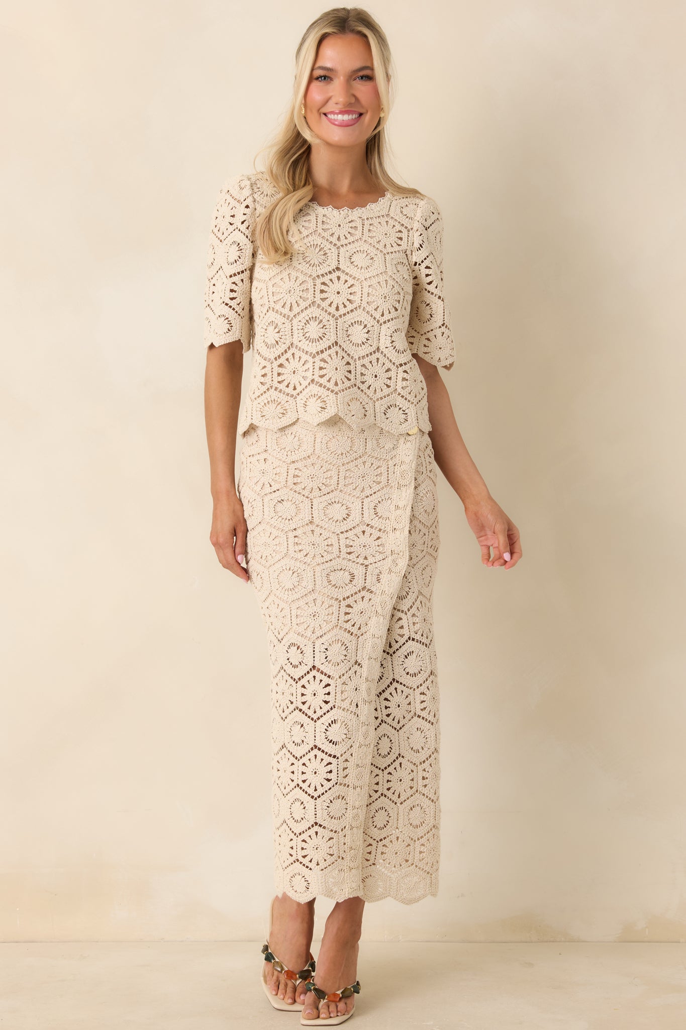 Lace top with structured fit, subtle texture, and scalloped detailing.