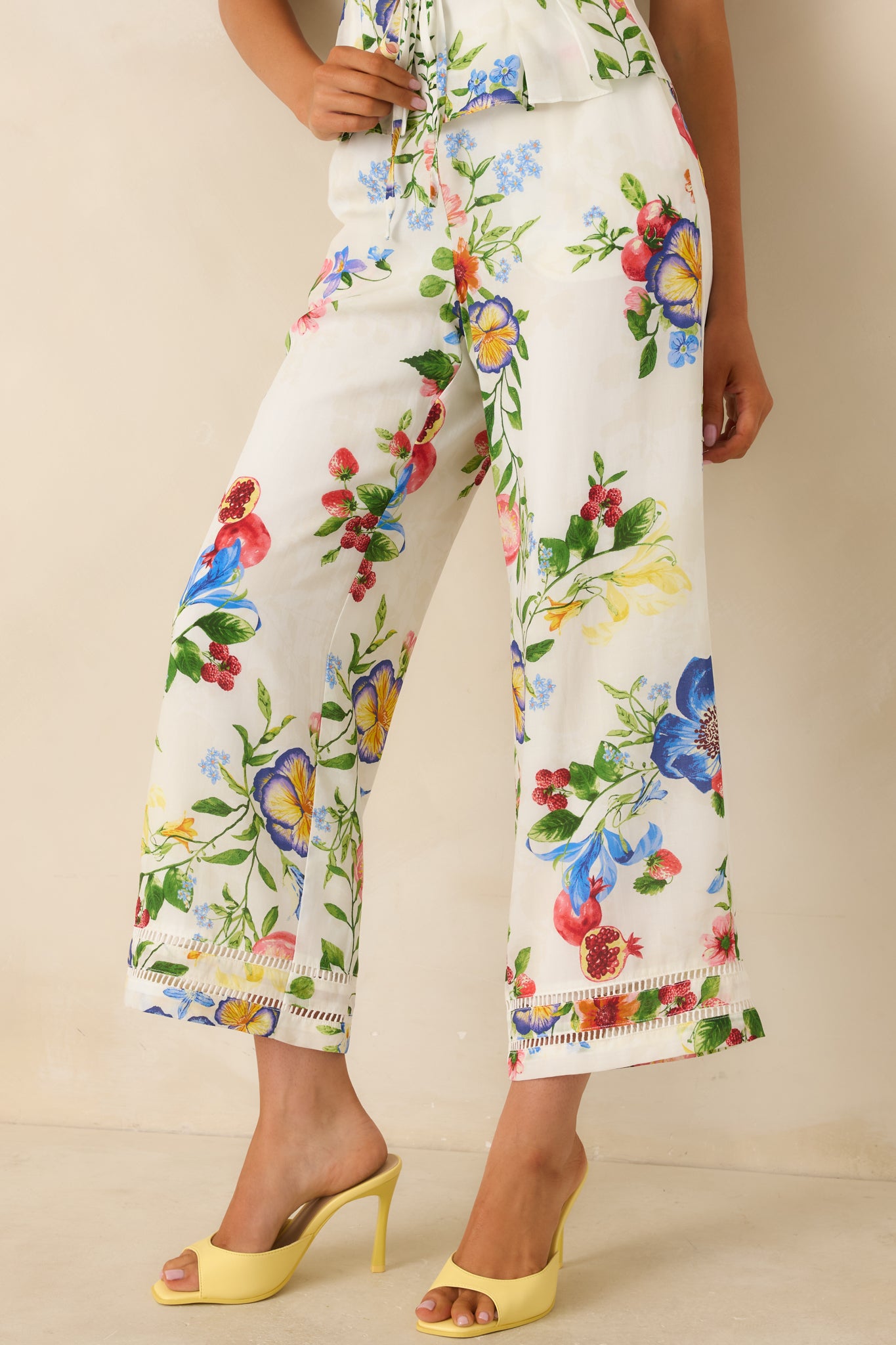 Close view of botanical print fabric showing vibrant floral pattern and soft texture.