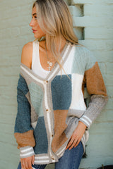 Front view of this cardigan that features a v-neckline, functional buttons down the front, stripe detailing along the hem and cuffs, cable knit detailing, and a soft knit material throughout.