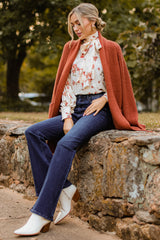 Full body view of  this cardigan that features a knit texture throughout.