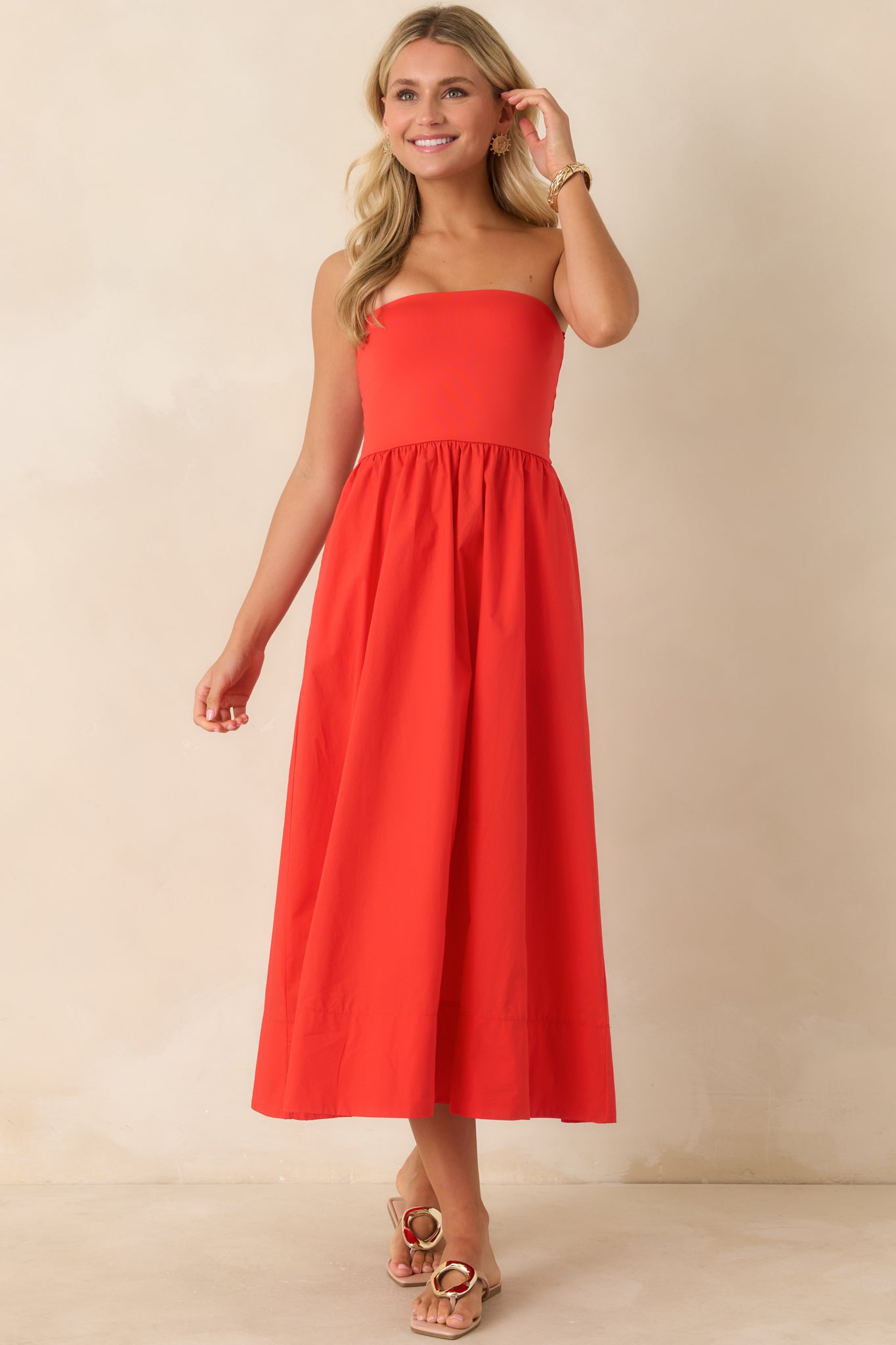 Front-facing full view emphasizing the pull-on design, side seam pockets, and smooth transition from the fitted upper bodice to the airy poplin skirt.

