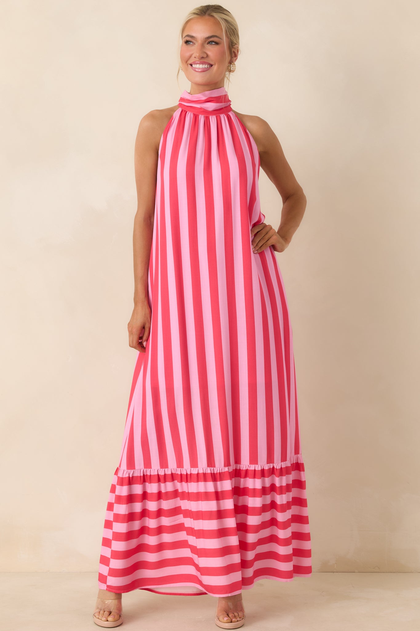 Pink and fuchsia vertical stripe dress with soft gathering at the neckline and a flowy shape.
