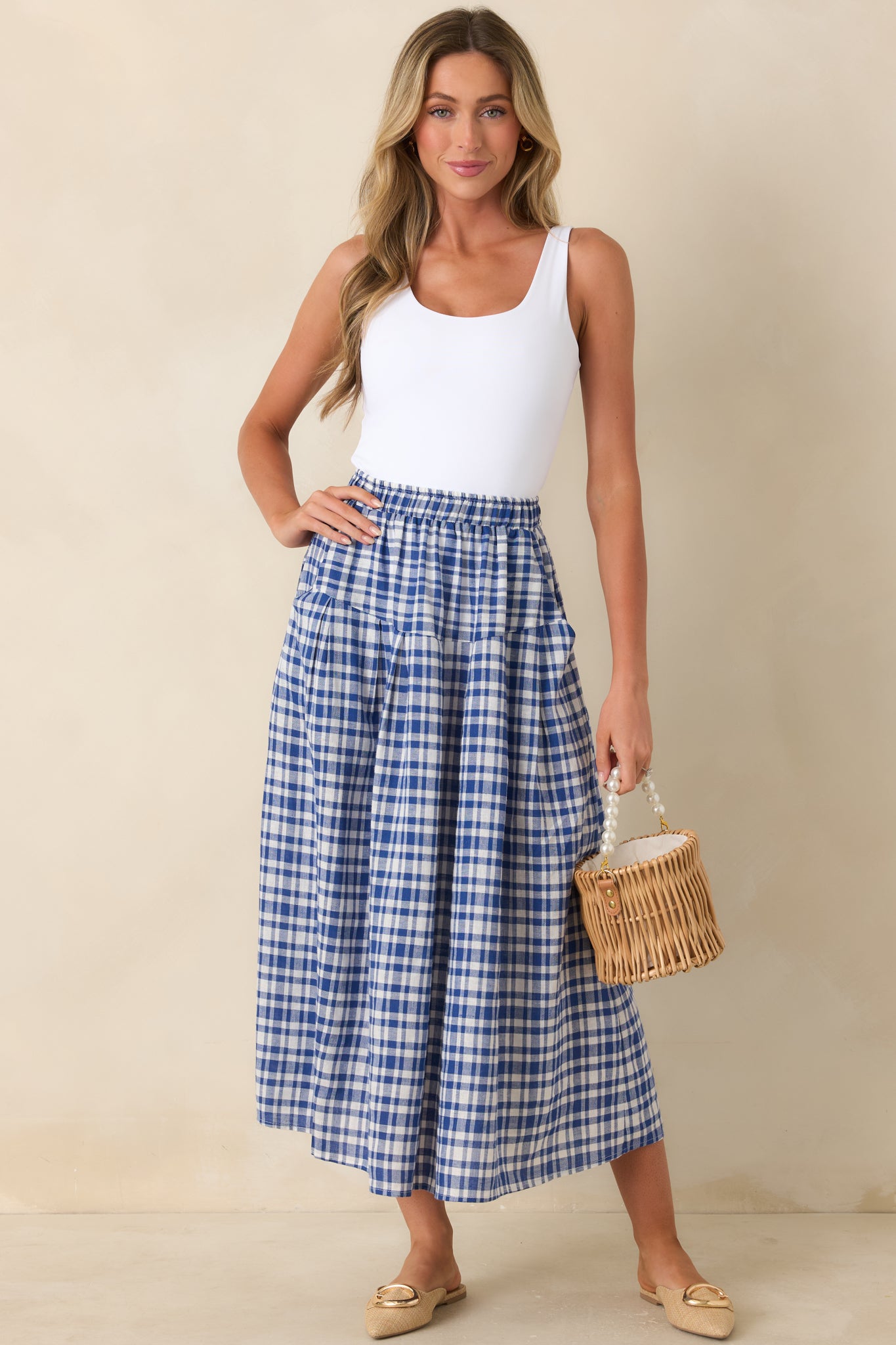 Blue and white gingham midi skirt with easy pull-on fit and flowing shape.