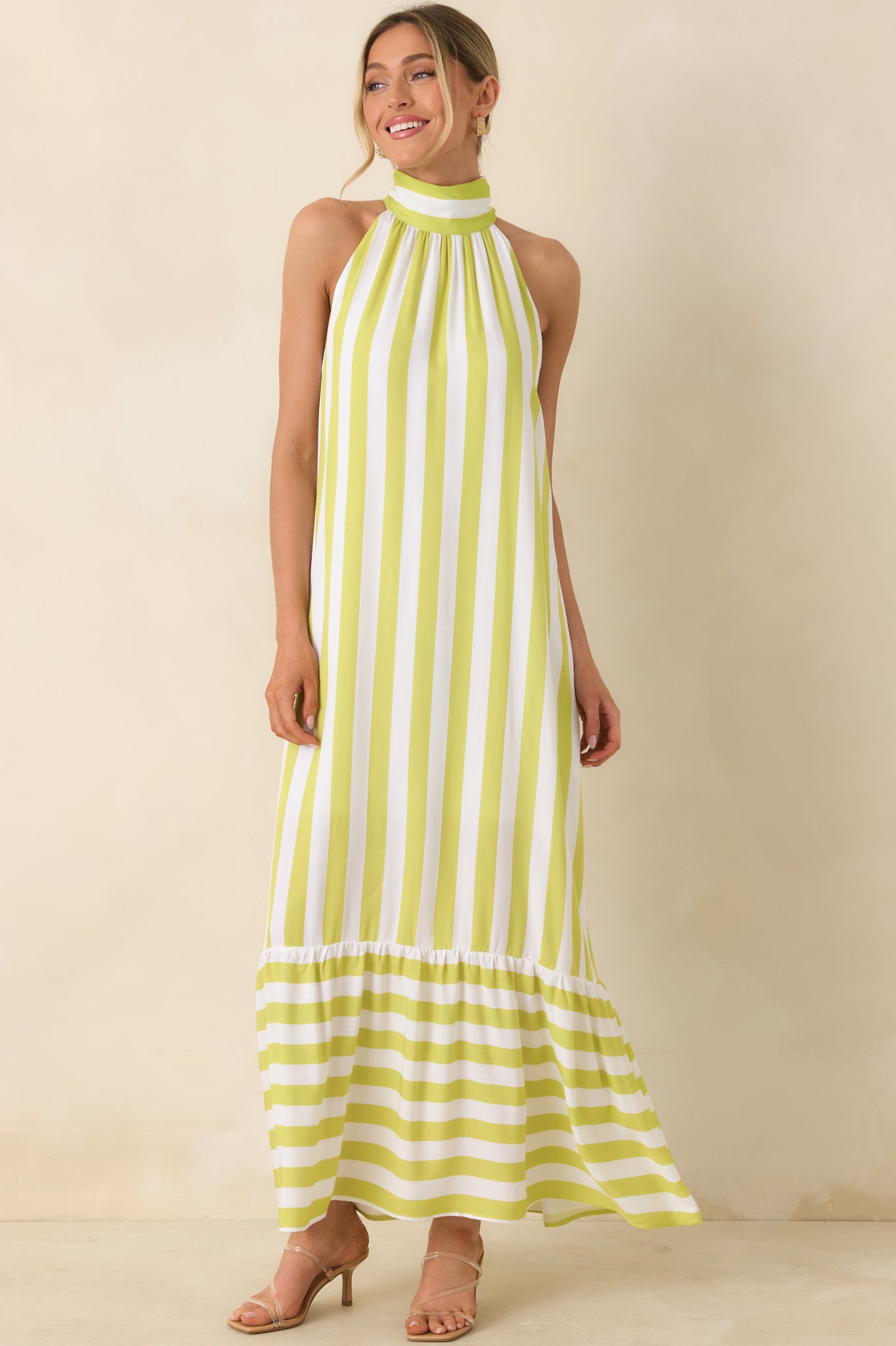 Vertical striped dress, with tiered skirt and contrasting horizontal stripe detail.