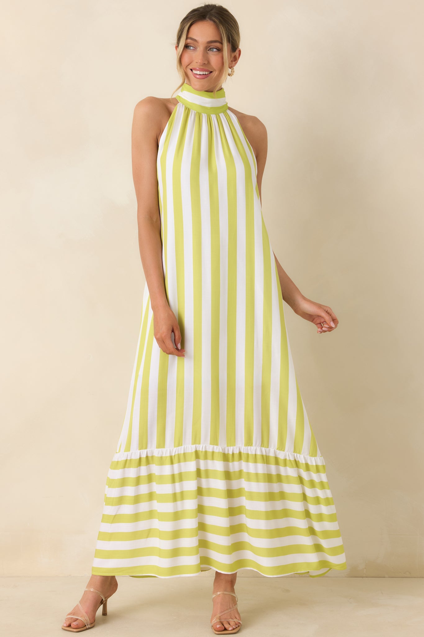 Lightweight halter dress, with chartreuse stripes and breezy tiered design.