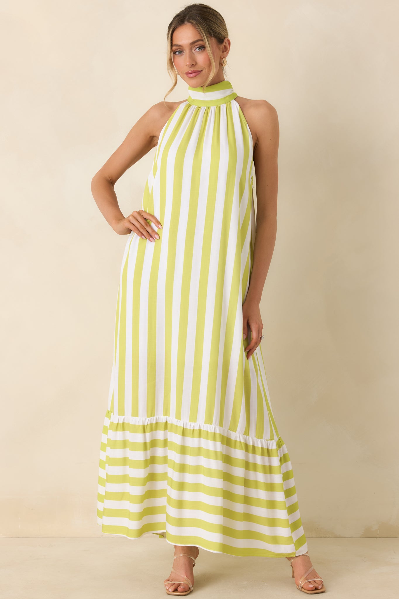 Green and white striped dress, with relaxed fit and dimensional mixed stripe pattern.