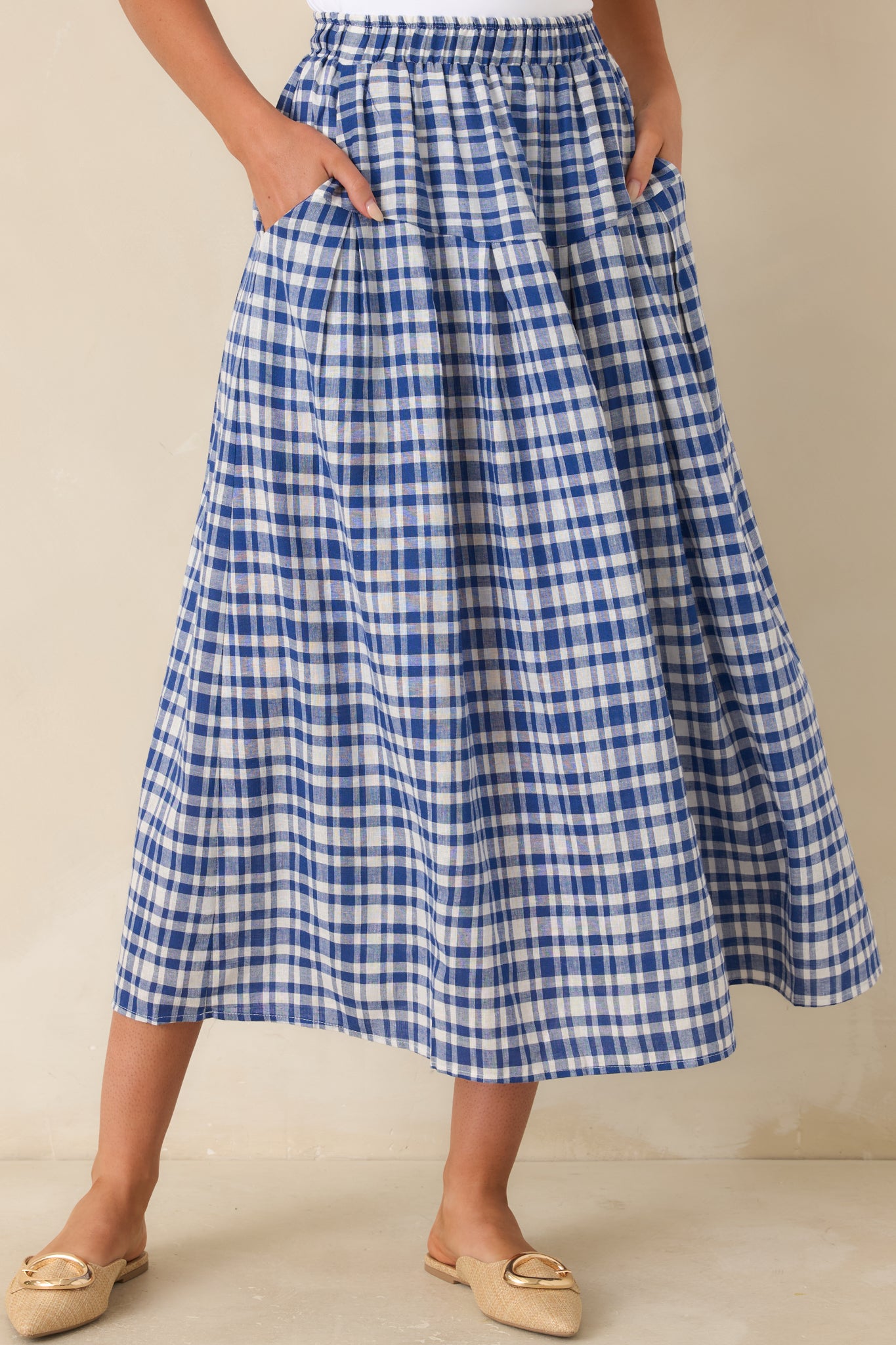 Gingham print skirt with elastic waistband and soft gathered detail.