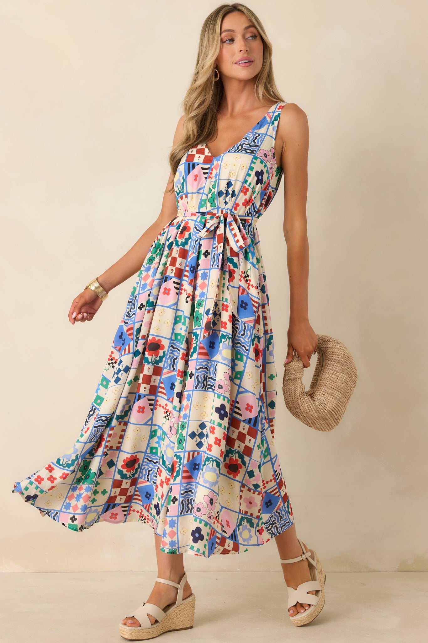 Lightweight midi dress with colorful blue, red, and green tile-inspired pattern.
