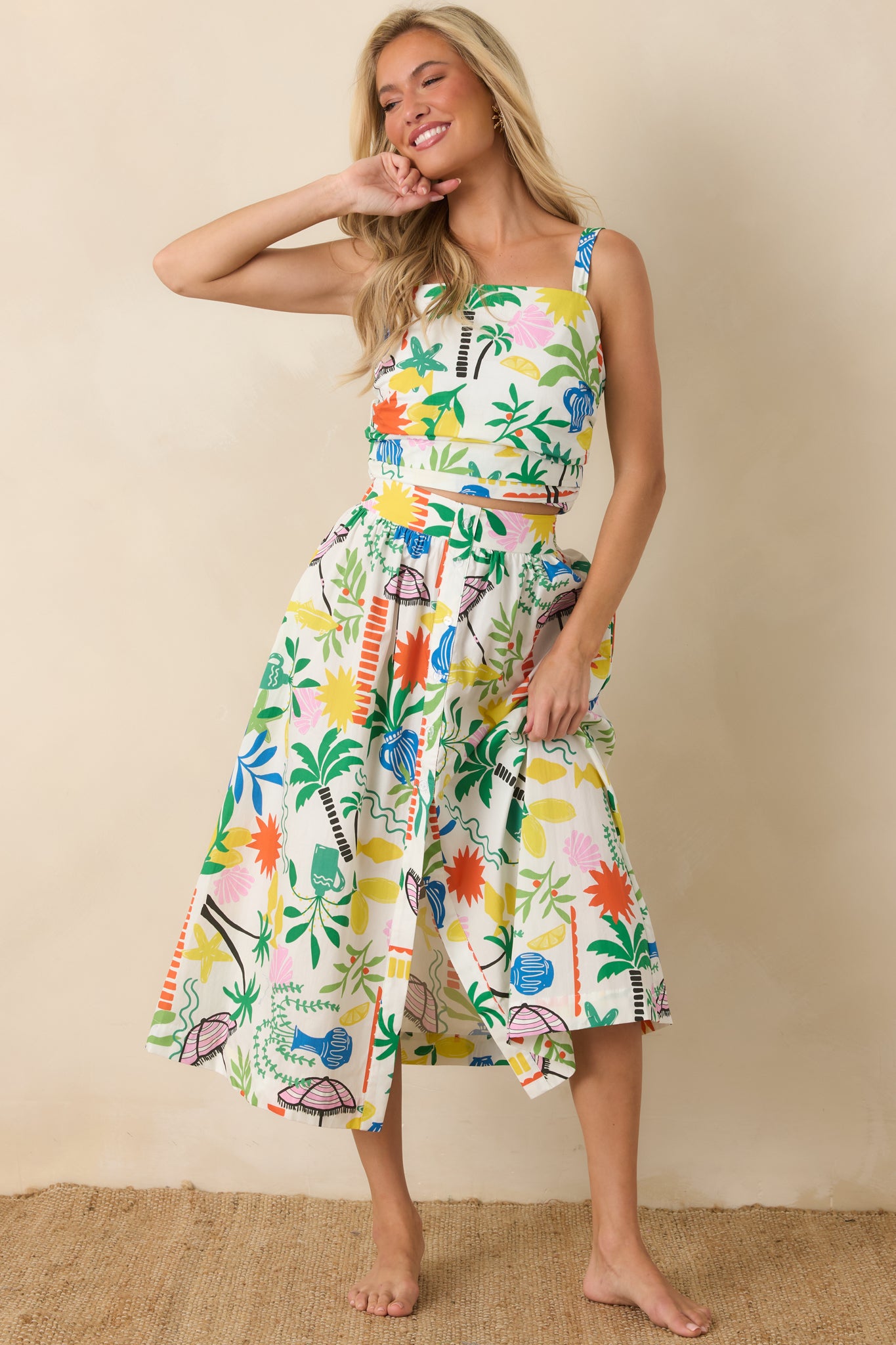 Lightweight cotton midi skirt with functional front button detailing, side pockets, and soft gathering at the waist.