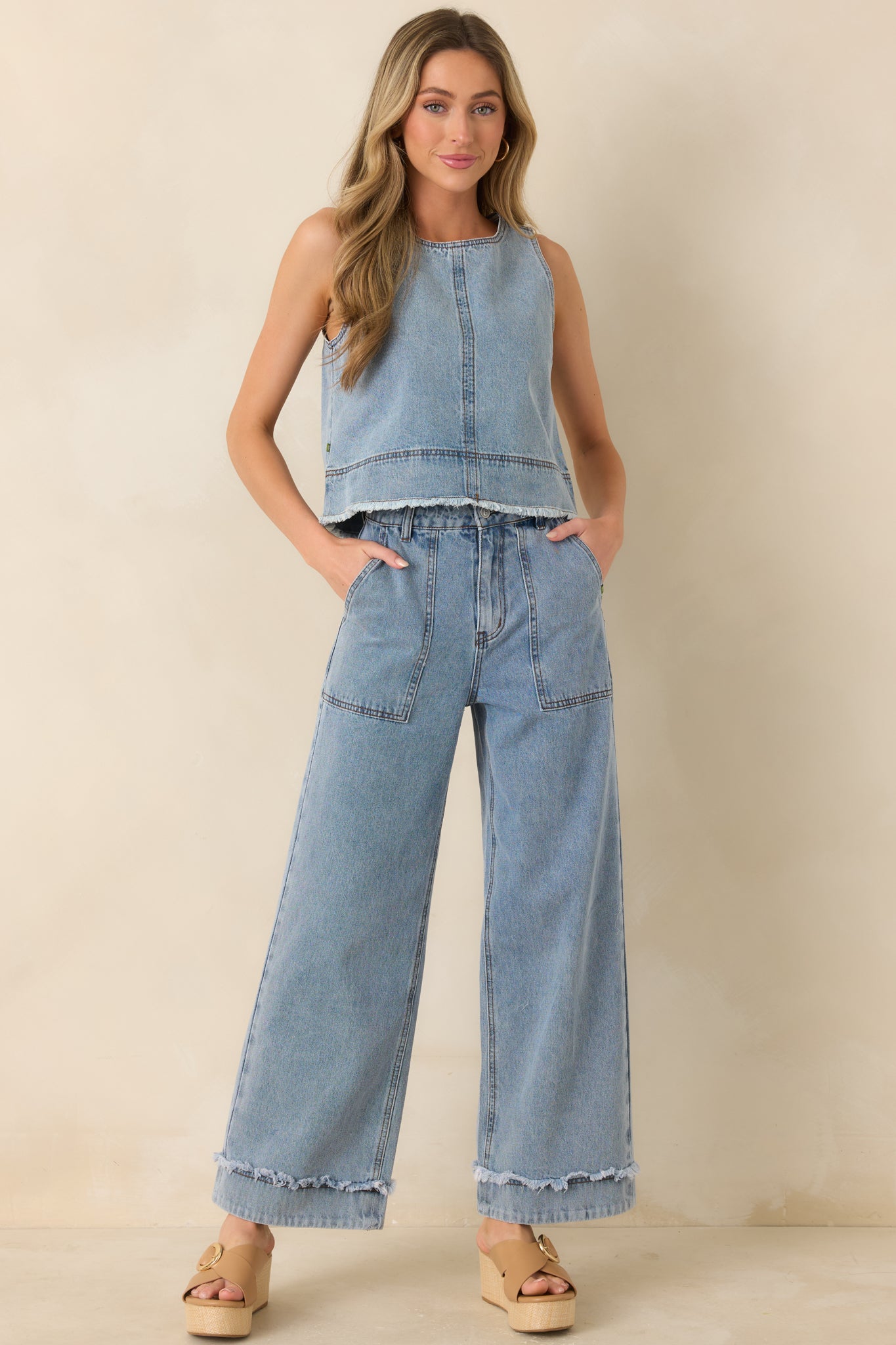 Cotton denim jeans, featuring a light wash finish, relaxed wide leg, and structured high-rise waist.
