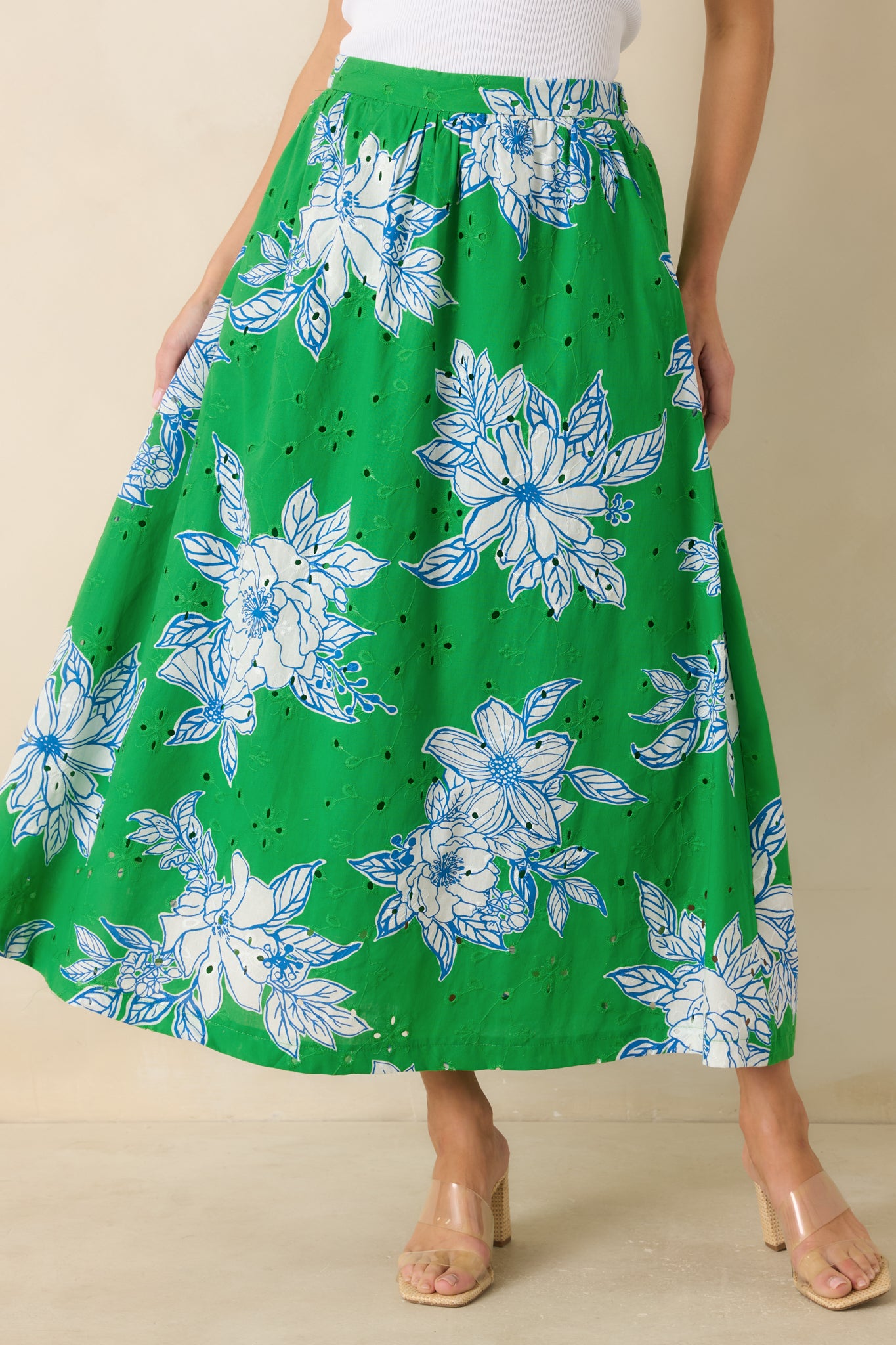 Close view of the elasticized waistband highlighting stretch comfort and gathered eyelet detailing at the top of the skirt.