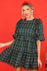 Front view of this dress that features a plaid pattern in shades of green, blue, and red.