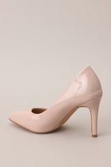 Back view of these Beige heels with a pointed toe, vibrant color, glossy finish, and skinny heel.