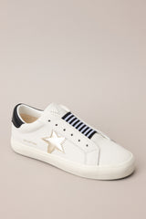 Angled view of these sneakers that feature a rounded toe, a laceless design, a comfortable fit, and a star detail.