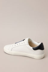 Inner-side view of these sneakers that feature a rounded toe, a laceless design, a comfortable fit, and a star detail.