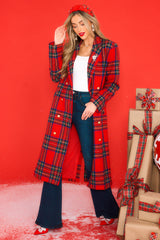 This red coat features a v-neckline, lapels, functional buttons down the front, functional pockets, a slit up the front and the back, and a thick, warm material.