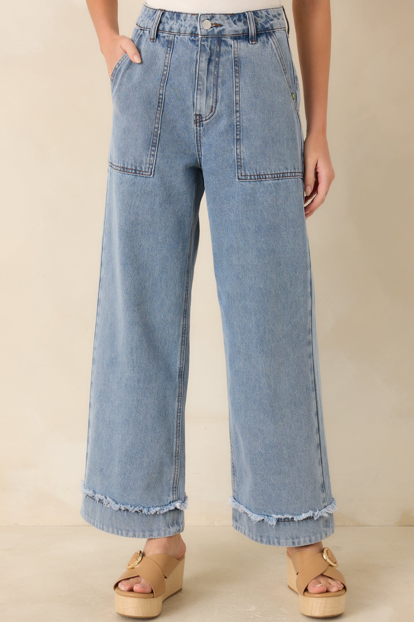 Denim jeans, with a close view of the wide leg silhouette and structured cotton fabric.