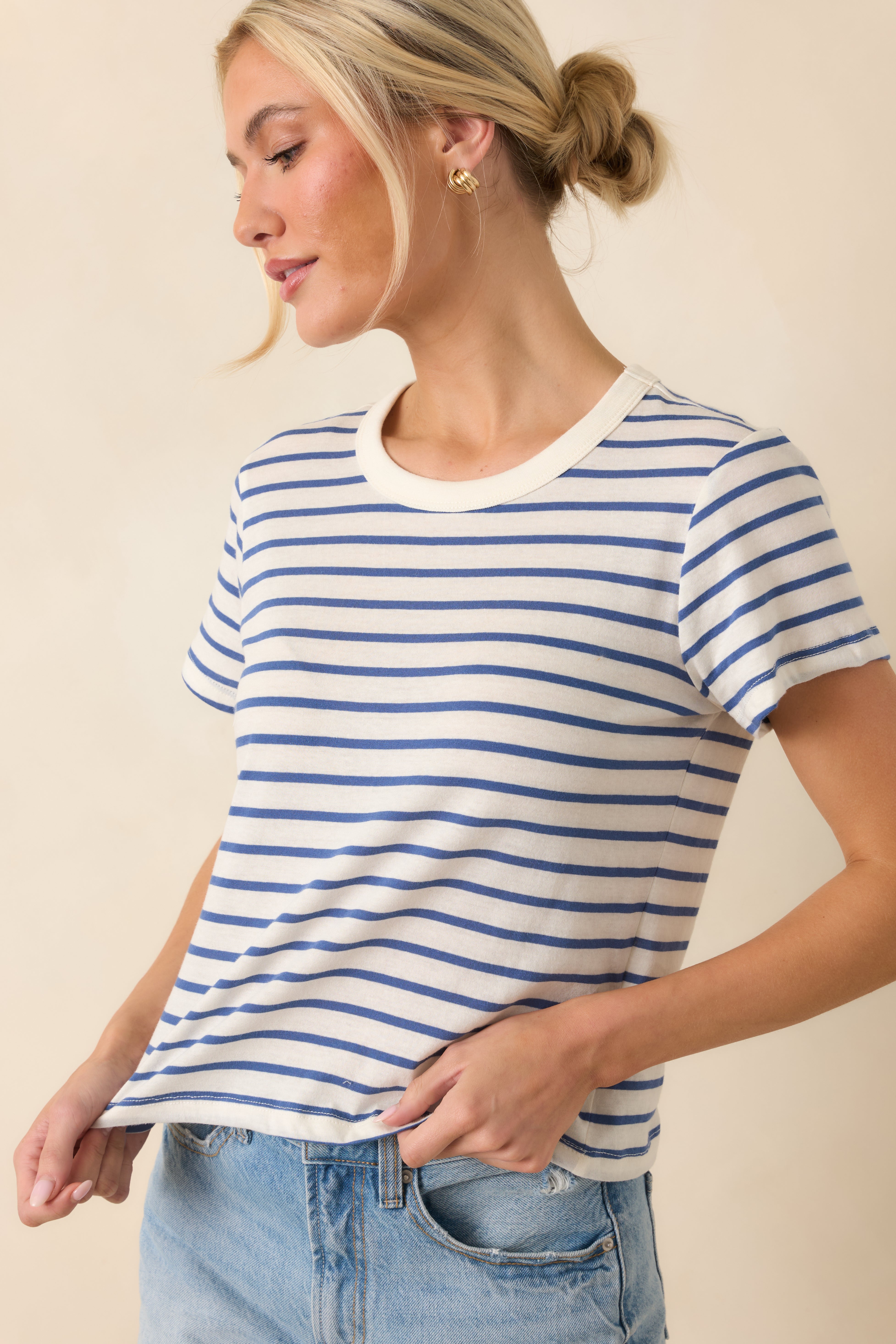 Close front framing of the crew neckline finished in clean ribbed trim for a classic look.