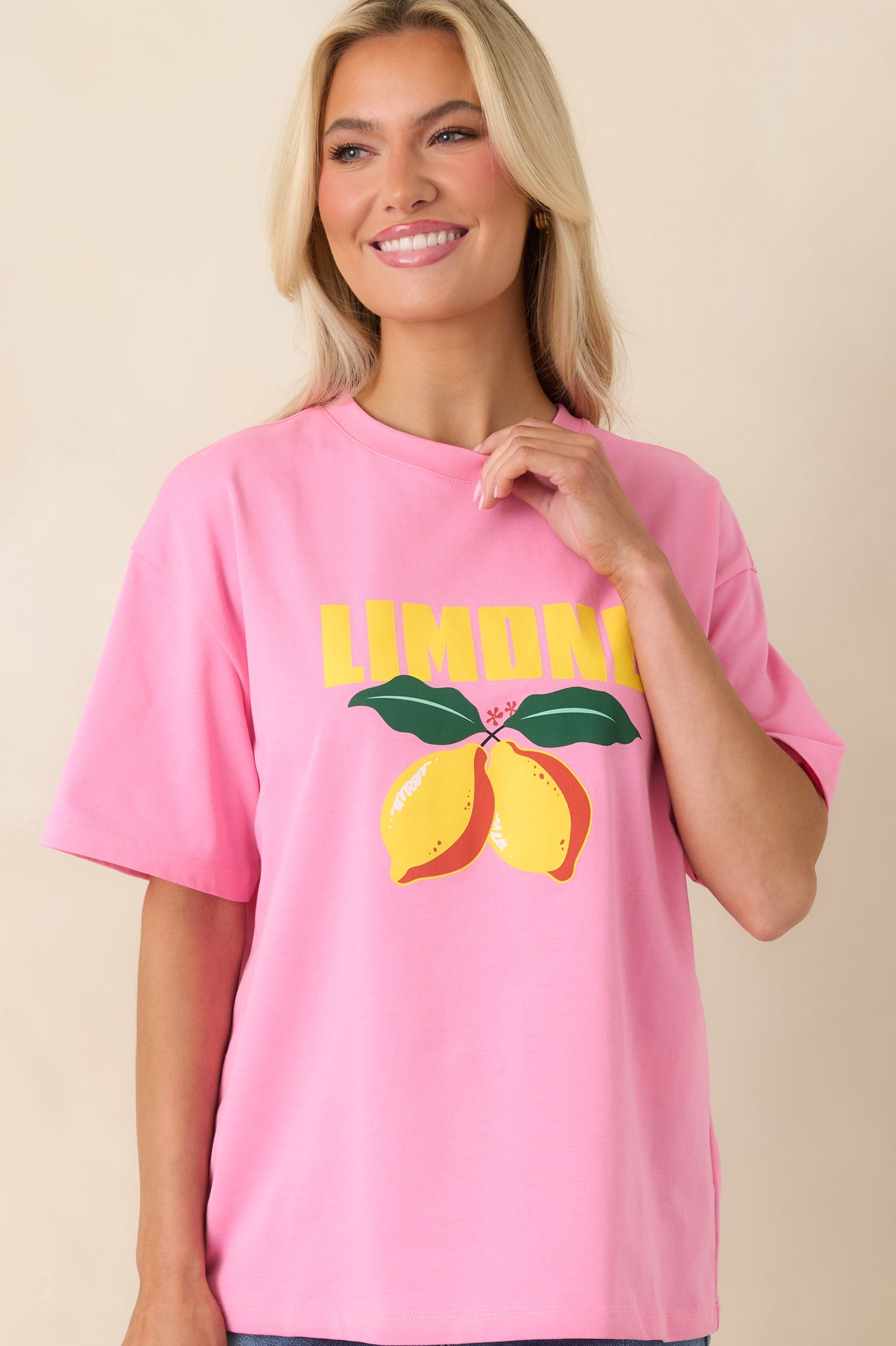 Cropped view of graphic tee showing bold citrus design and relaxed shape.