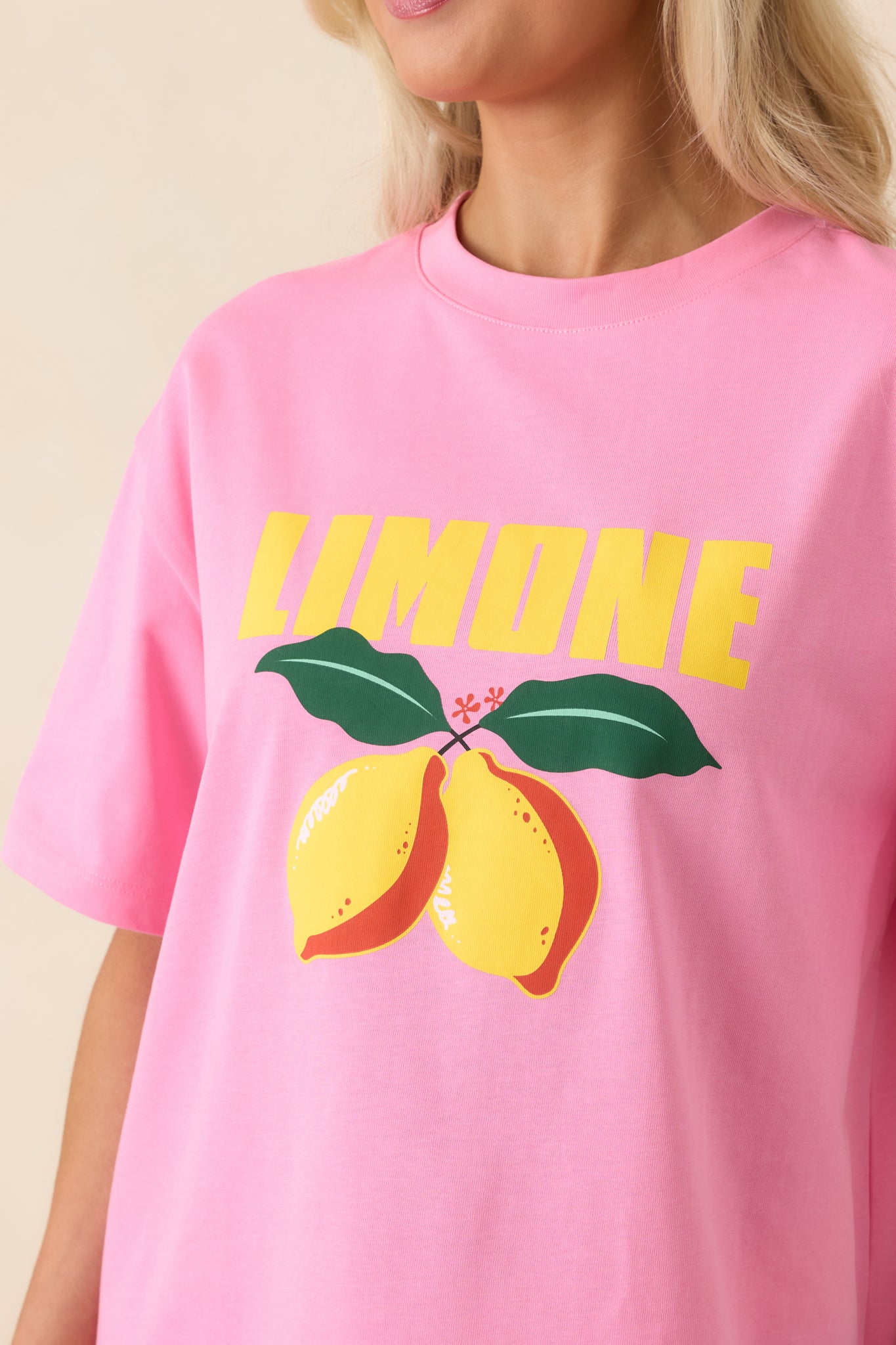Bold “Limone” graphic and citrus motif printed on soft pink cotton fabric.