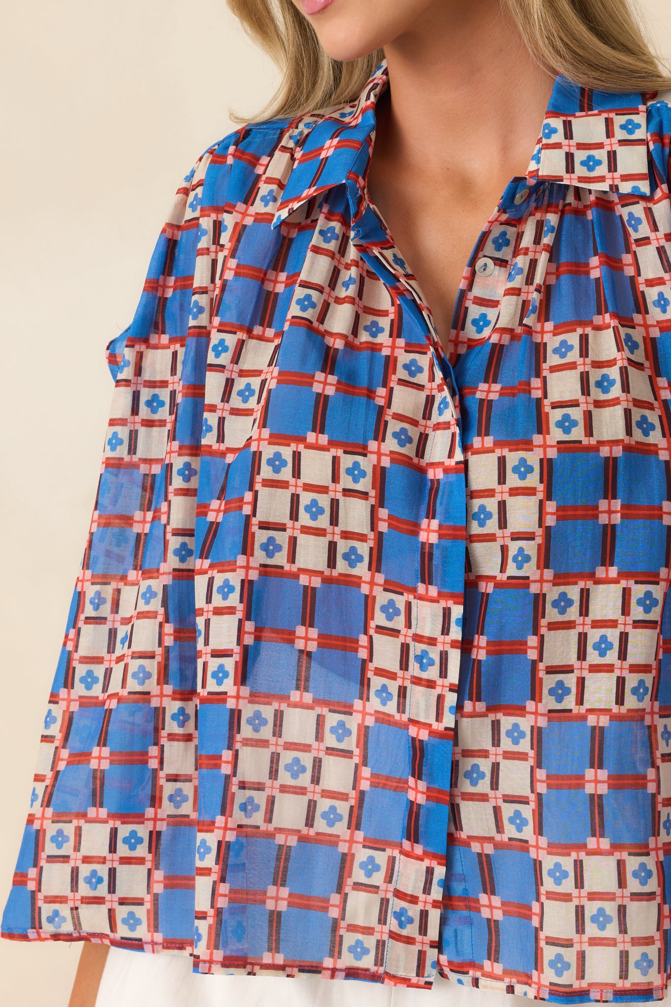 Close-up of geometric tile-inspired print on sheer cotton-silk blend fabric.