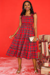 Front view of this dress that features thick ruffle straps, smocked bodice, and a tiered skirt.