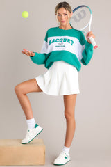 This green and white sweatshirt features a ribbed crew neckline, high contrast color blocking, embroidered & terry cloth wording, ribbed cuffed sleeves, and a ribbed hemline.