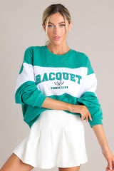 Front view of this sweatshirt that features a ribbed crew neckline, high contrast color blocking, embroidered & terry cloth wording, and ribbed cuffed sleeves.