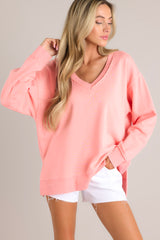 Front view of this sweatshirt that features a v-neckline, a soft material, a split hemline, and ribbed cuffed sleeves.