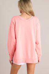 Back view of this sweatshirt that features a v-neckline, a soft material, a split hemline, and ribbed cuffed sleeves.
