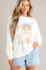 Close up view of this sweatshirt that features a crew neckline, a unique graphic, ribbed cuffed long sleeves, and a ribbed hemline.