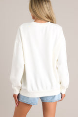 Back view of this sweatshirt that features a crew neckline, a unique graphic, ribbed cuffed long sleeves, and a ribbed hemline.