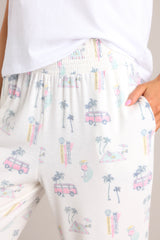 Close up view of the waistband of these joggers that feature a high waisted design, a fully smocked waistband, functional hip pockets, and cuffed ankles.