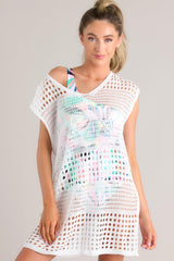Front view of this white open knit cover up with a v-neckline. 