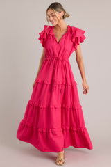 Full body view of this dress that features a tiered design and a long flowy skirt.