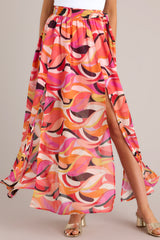 Front view of this skirt that showcases the pattern of the fabric in shades of orange and pink.