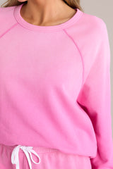 Close up view of this sweatshirt that features a crew neckline, a super soft material, an ombre design, and ribbed cuffed sleeves.