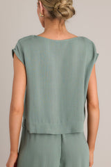 Back view of this top that features a rounded neckline, a lightweight material, and wide short sleeves.