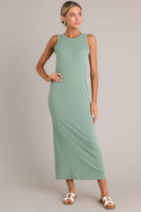 Full body view of  this dress that features a scoop neckline, a slit in the back and, a super soft material.
